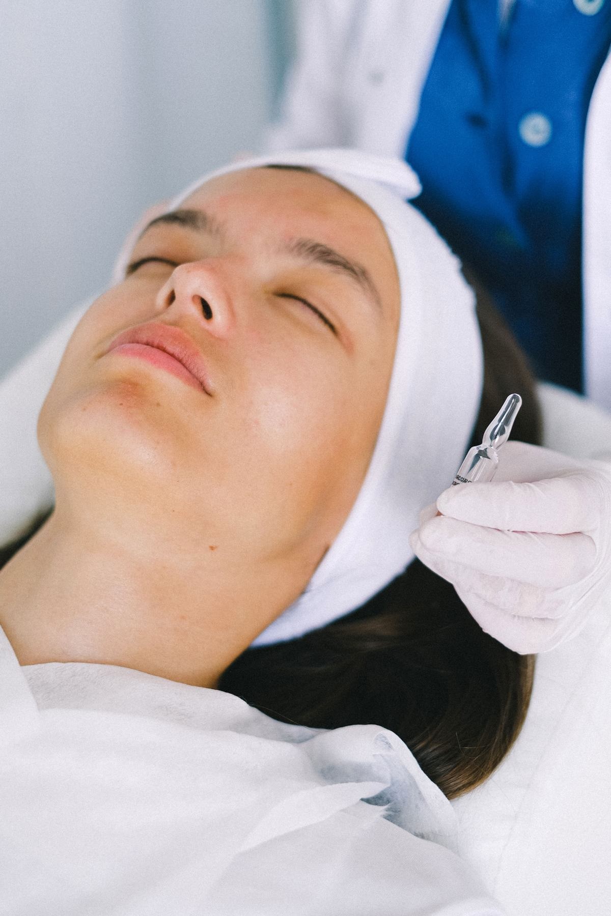 Laser Aesthetic Treatments in Calgary 9 Client during a microneedling skin treatment, comparing microneedling and RF microneedling